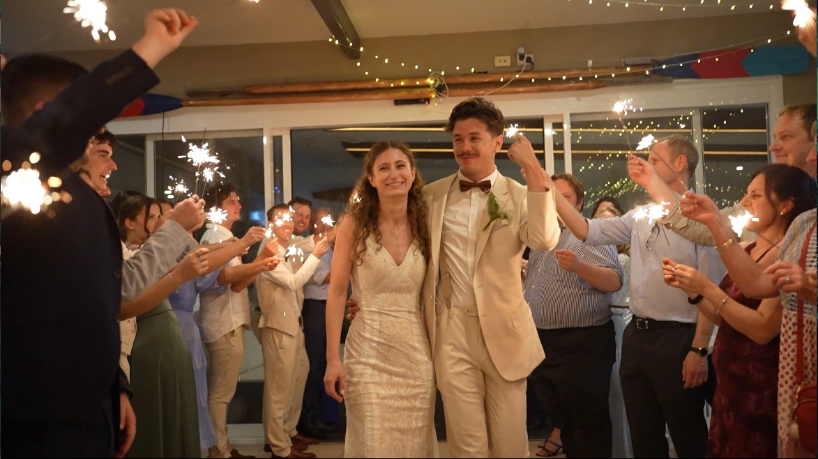 Sydney wedding videographer - A happy, just married couple, leaving the wedding reception